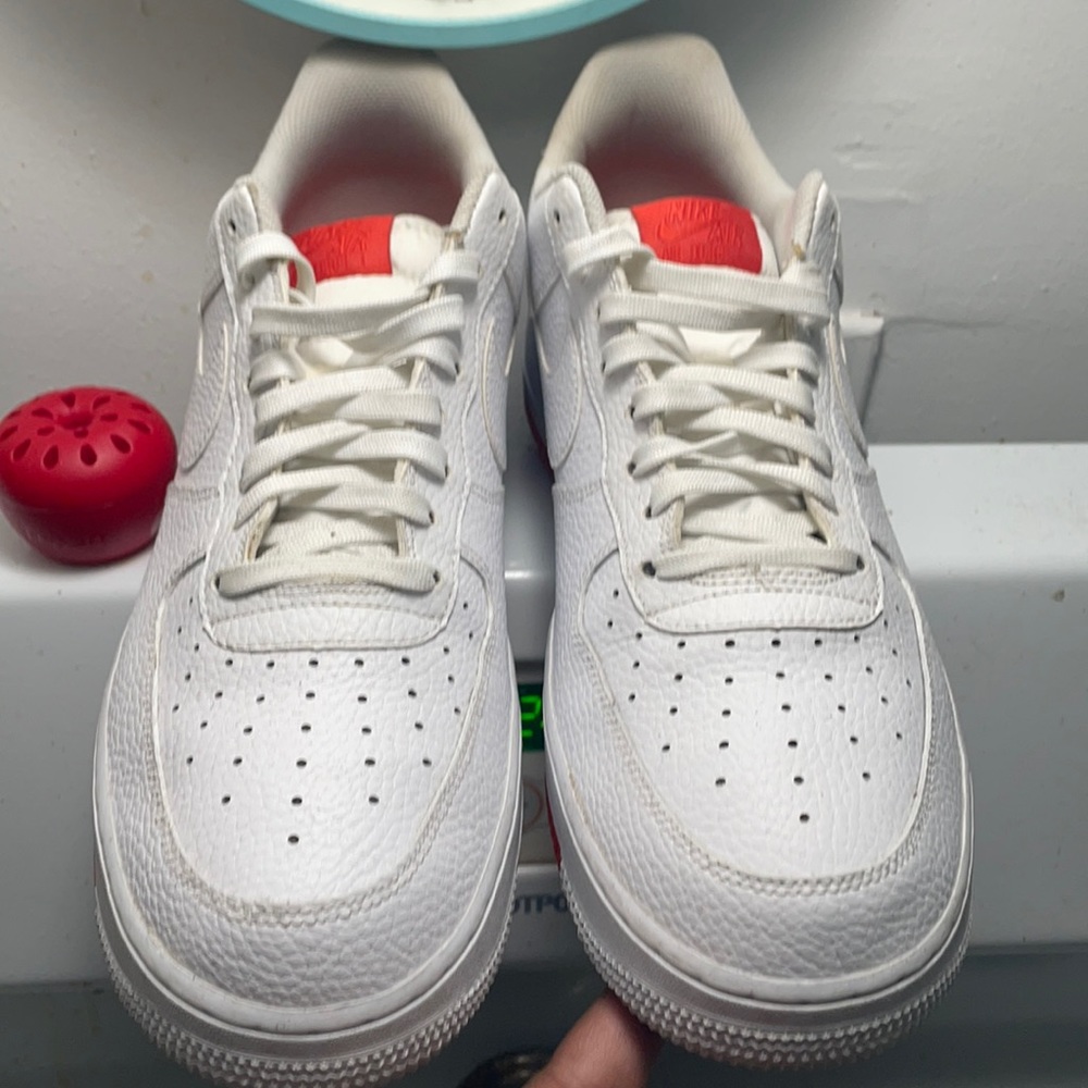 White low tops uptown’s with the red bottom